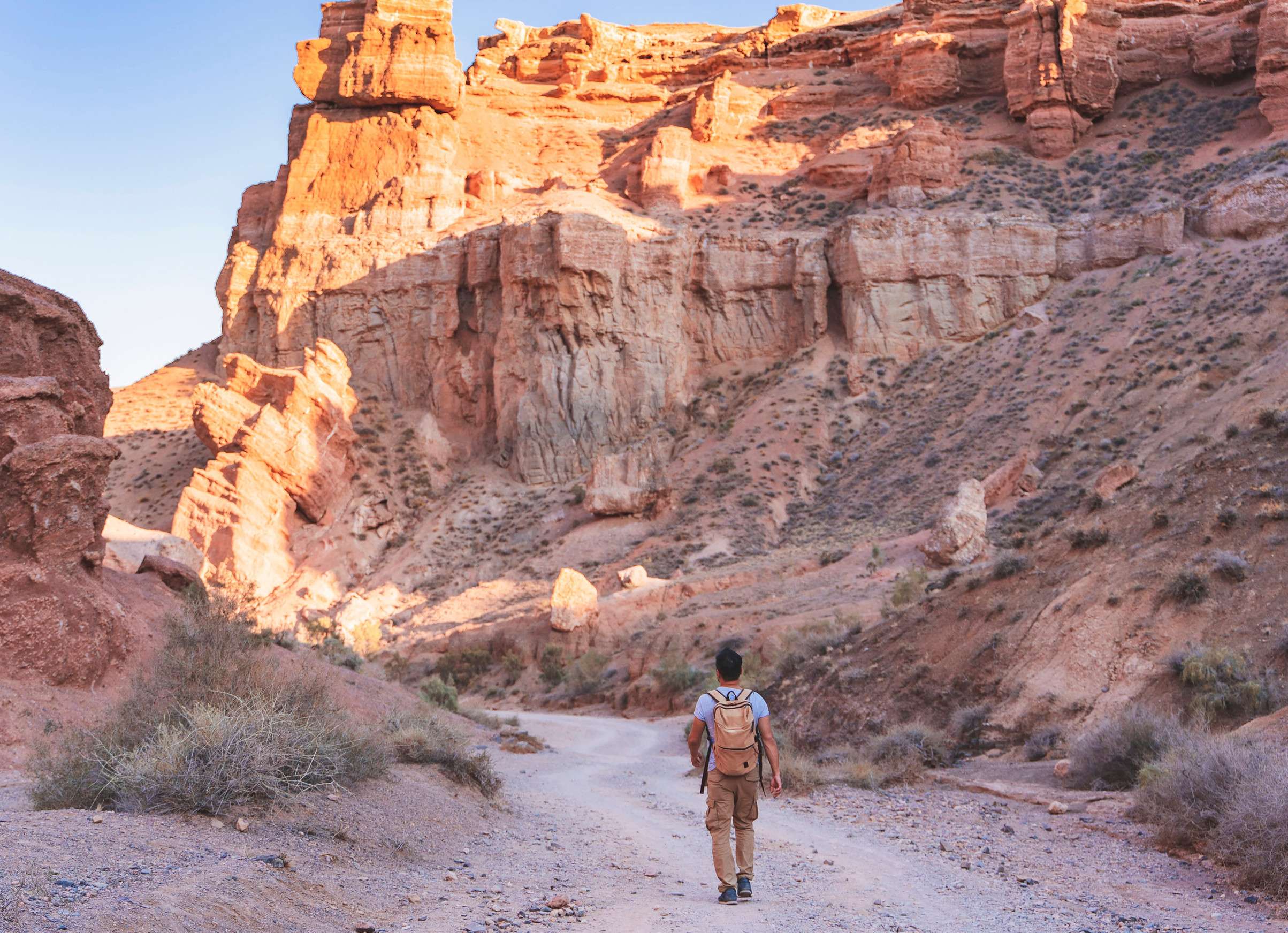Tourist Walking Through The Charyn Canyon